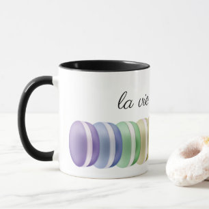 Colorful stack of sweet macarons: la vie est belle mug