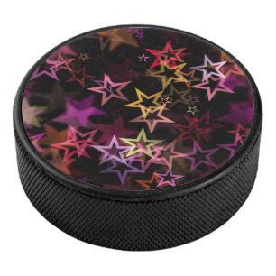 Colorful Stars Dance Whimsically  Hockey Puck