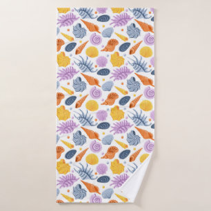 Colorfull seashells on white bath towel