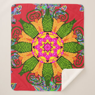 Coloured round floral mandala on a red,  green and sherpa blanket