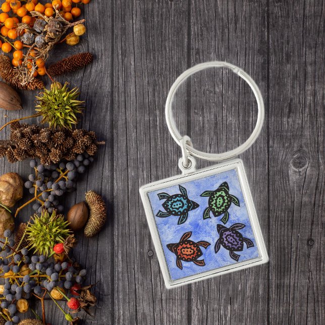 Colourful Abstract Turtles Keychain (Four black abstract turtles with coloured shells on blue keychain.)