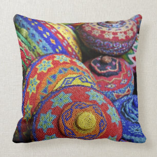 Colourful baskets made from coloured plastic beads throw pillow