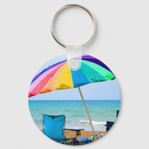 Colourful beach umbrella and chairs in Florida Keychain