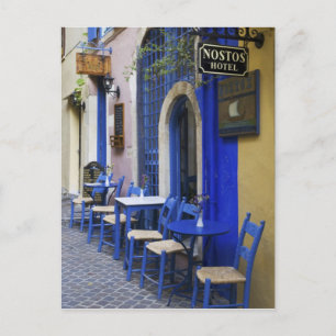 Colourful Blue doorway and siding to old hotel in Postcard