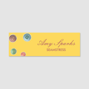 Colourful buttons seamstress yellow name tag