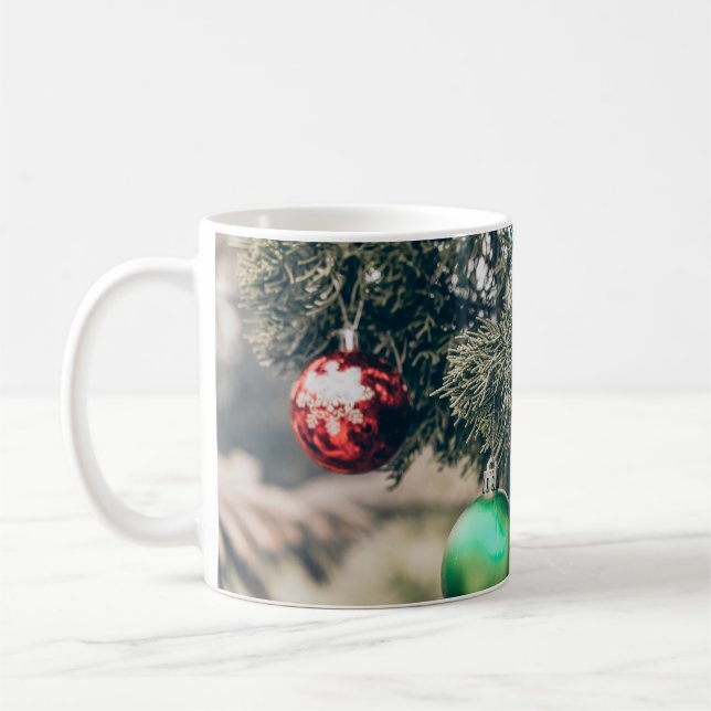 Colourful Christmas bauble decoration on a tree. V Coffee Mug (Left)