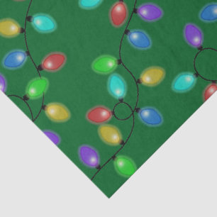 Colourful Christmas Lights On Green Tissue Paper