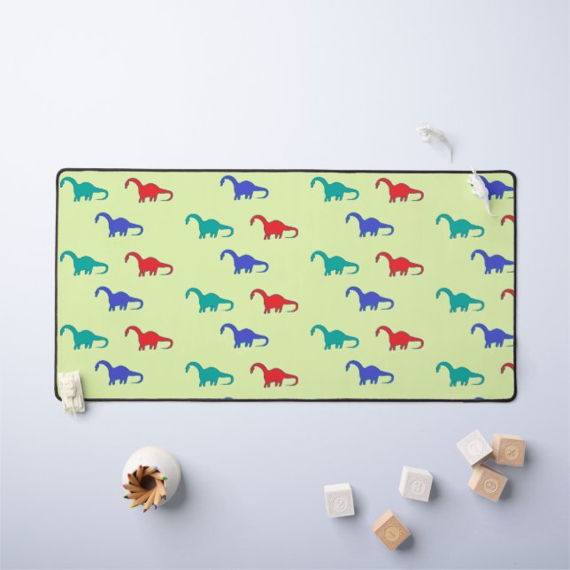 Colourful dinosaurs pattern on green desk mat (Kids Table)