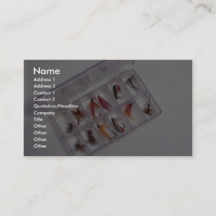 Colourful fishing hooks kept in fly box business card