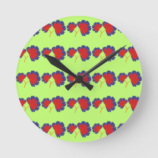 Colourful Flower Pattern on Green Background Round Clock