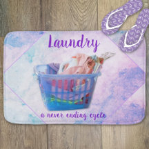Colourful Folded Laundry On Hangers In Blue Basket