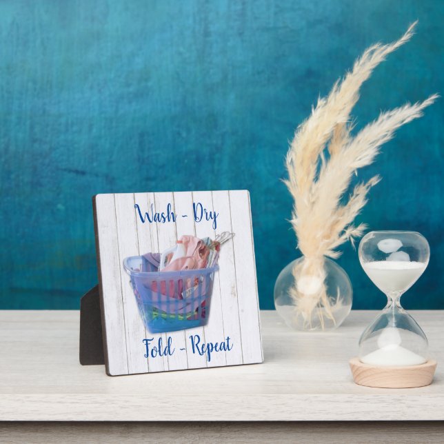 Colourful Folded Laundry On Hangers In Blue Basket Plaque (Insitu)