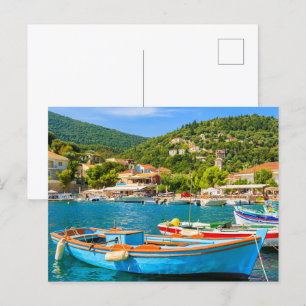 Colourful Greek fishing boats in port of Kioni Postcard