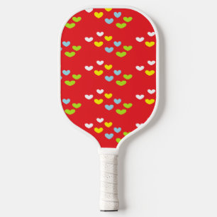 Colourful hearts on red pickleball paddle