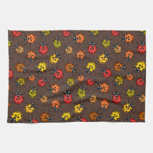 Colourful ladybugs on brown kitchen towel