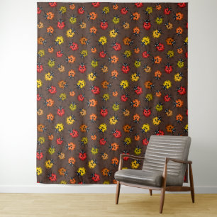 Colourful ladybugs on brown tapestry
