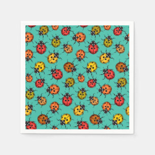 Colourful ladybugs on turquoise napkin