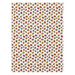Colourful ladybugs on white tablecloth