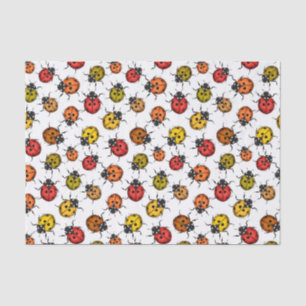 Colourful ladybugs on white tissue paper