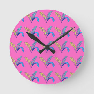 Colourful Leaf Pattern on Pink Background Round Clock