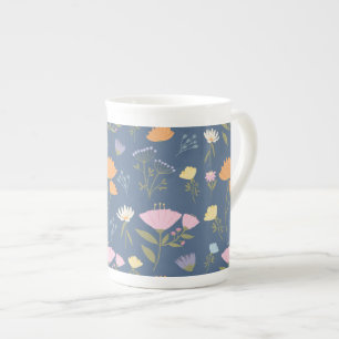 Colourful meadow on blue bone china mug