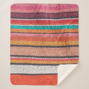 Colourful mexican, peruvian style rug surface clos sherpa blanket