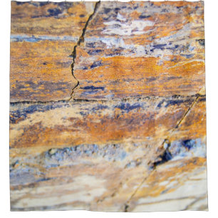 Colourful natural stone wall pattern in a quarryan
