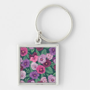 Colourful pansies on dark greenish blue keychain