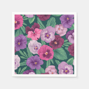 Colourful pansies on dark greenish blue napkin