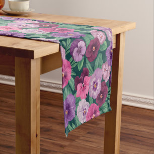Colourful pansies on dark greenish blue short table runner