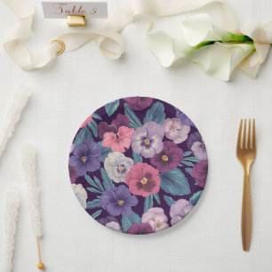 Colourful pansies on deep violet paper plate