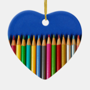 Colourful pencil crayons on blue background ceramic ornament