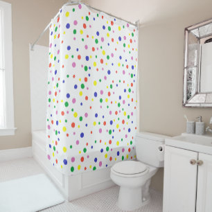 Colourful polka dots in rainbow colours on white