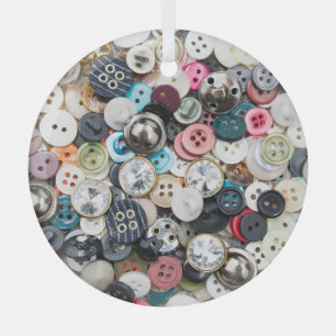 Colourful sewing buttons, natural fabric backgroun glass ornament