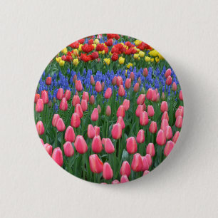 Colourful spring tulip garden 2 inch round button