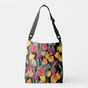 Colourful tulips, isolated black background. crossbody bag