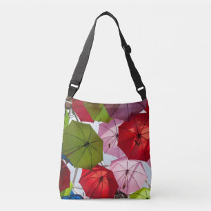 Colourful umbrella background crossbody bag