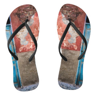 Colourful wall with blue door flip flops