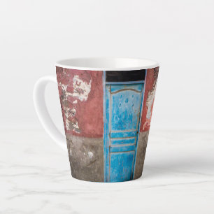Colourful wall with blue door latte mug