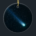 Comet in Night Sky Ceramic Ornament<br><div class="desc">A blazing comet creates a brilliant fuzzy ball in the night sky,  followed by a blue wispy tail as it moves slowly among the stars in this enhanced stellar view.</div>