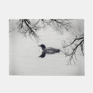 Common Loon Swims in a Northern Lake in Winter Doormat