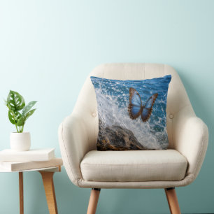 Common Morpho Butterfly Flying Over Ocean Rock Throw Pillow