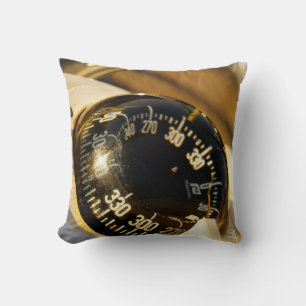 Compass helps navigate and maintain course. throw pillow