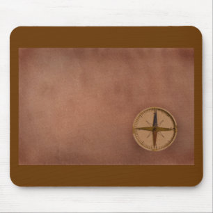 compass on old paper mouse pad