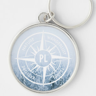 Compass star emblem monogram winter spruce forest keychain