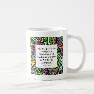 Compassion is taught coffee mug