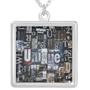 Composition of letterpress blocks silver plated necklace