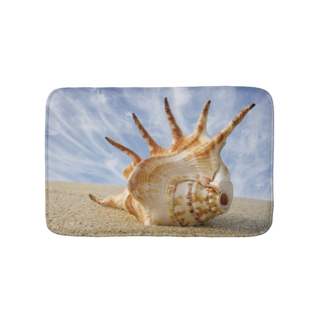 Conch Shell on Sandy Beach, Blue Sky Bath Mat (Front)