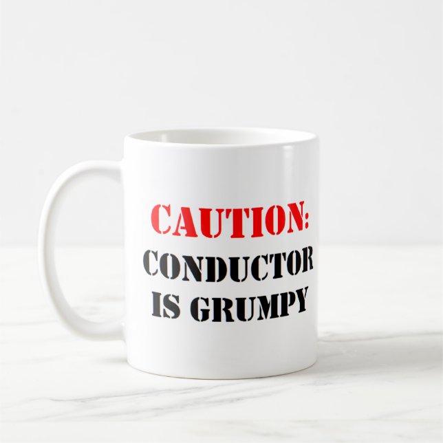 conductor is grumpy coffee mug (Left)