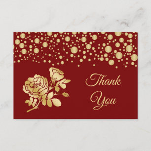 Confettis d'or, roses sur le Merci rouge de